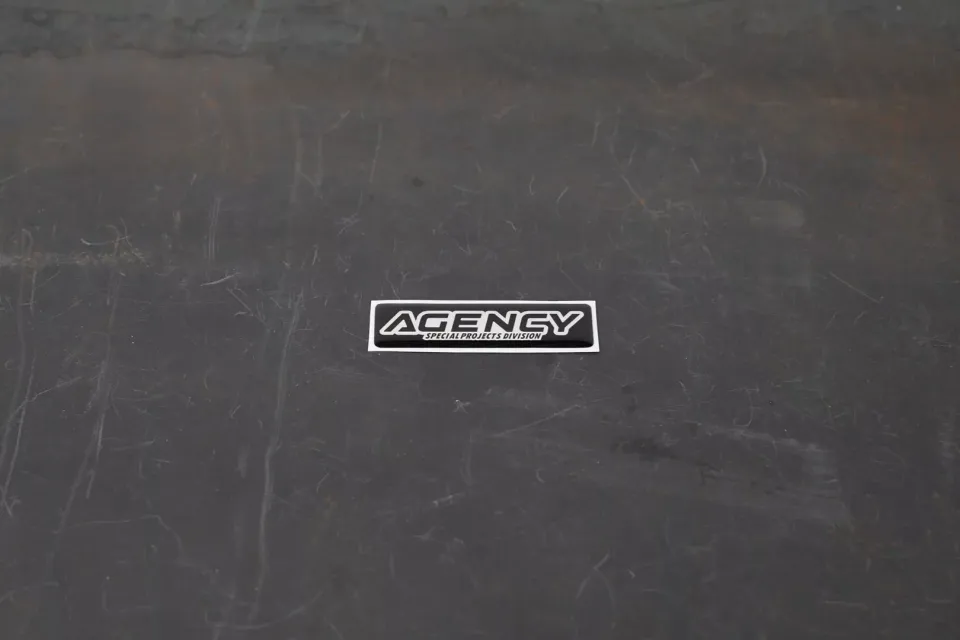 agency-arms-special-projects-division-sticker-3d-noir-argent-1x4-6 image 1