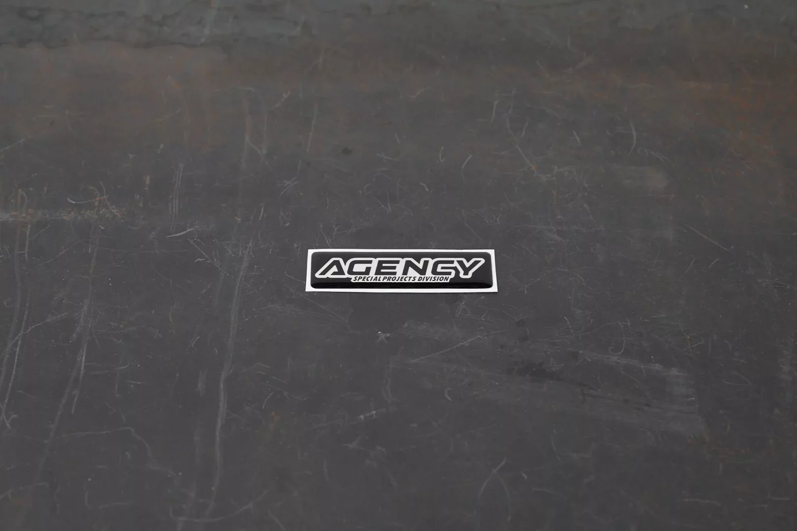 agency-arms-special-projects-division-sticker-3d-noir-argent-1x4-6 image 1