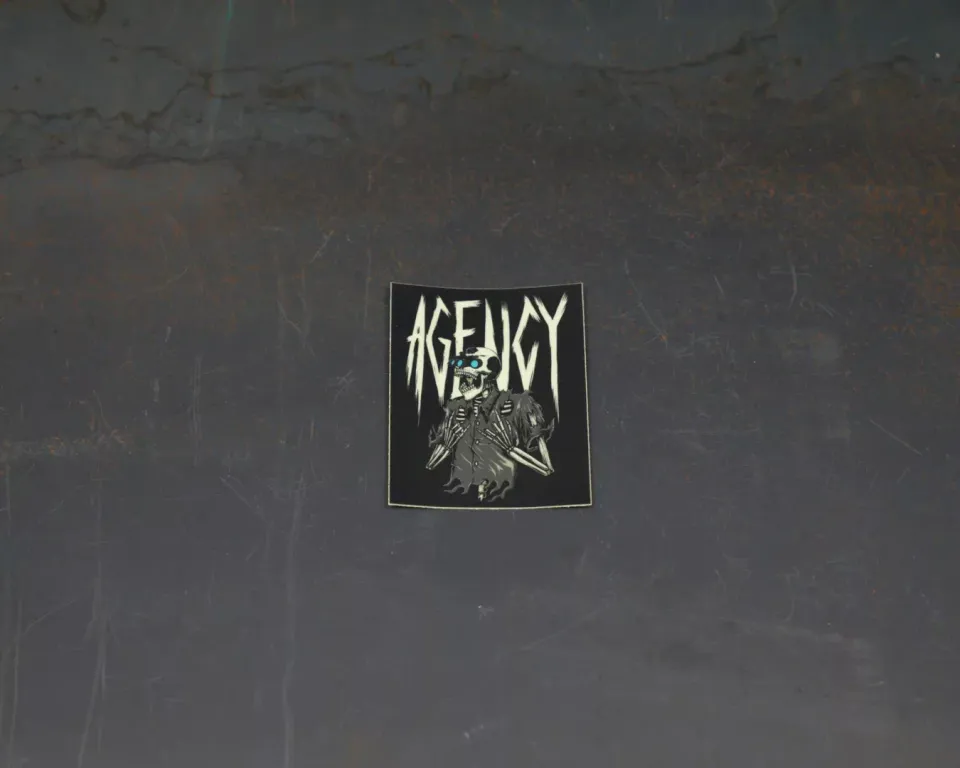 agency-arms-rock-out-sticker-phosphorescent-vinyle-mat-7x9-cm image 1